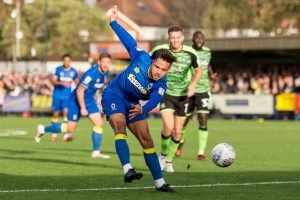 AFC Wimbledon up to League One after Lyle Taylor sinks Plymouth