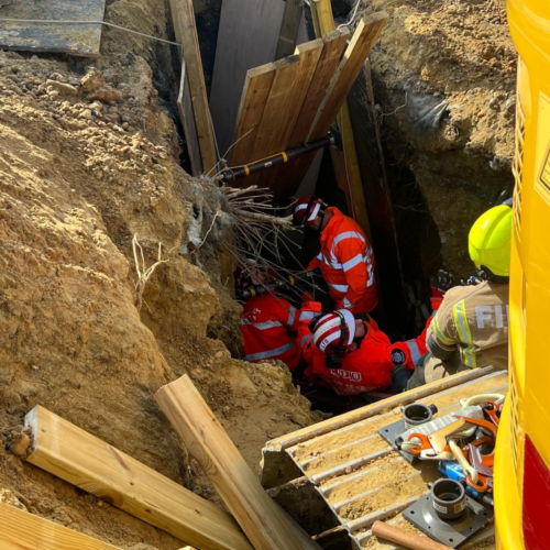 Firefighters rescue man trapped in sand and clay after trench collapse ...